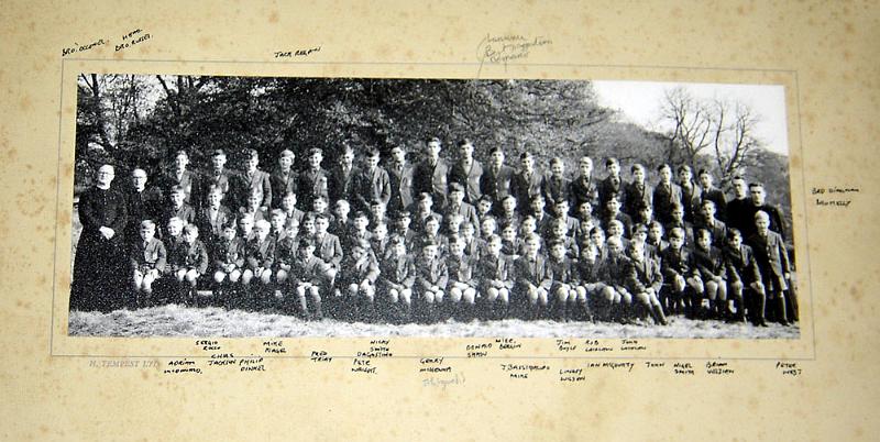 Class Photo 2 1953.jpg - One of the original photographs taken of the school back in 1953. The picture was supplied by Aiden Bremner.Bert D'Agostino added:-I’ve had a good laugh at the attached “original” photo from 1953.  From memory I always thought there were only 12 of us in the original 1st year class in Oct ’53 but I can count 14 in the photo and I can’t indentify Gerry Minchella which would make it 15. Also I can’t find my brother Gerry who would be in the photo.I can identify the following in the back row from left to right.  “?” indicates I’m not absolutely certainJames Robertson?Andrew Robertson?UnknownJack ReganDanny GibbonsJohn Shaw?Eddie StoneDominic MinchellaLudovic ChzrszczBert D’AgostinoLaurence DemarcoFrank StrathiePeter NicollMike Ashley
